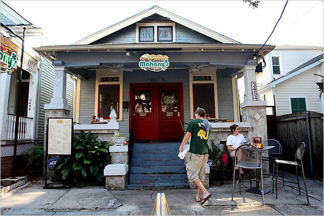 Photo of Mahony's Po-Boy's storefront with customer walking in